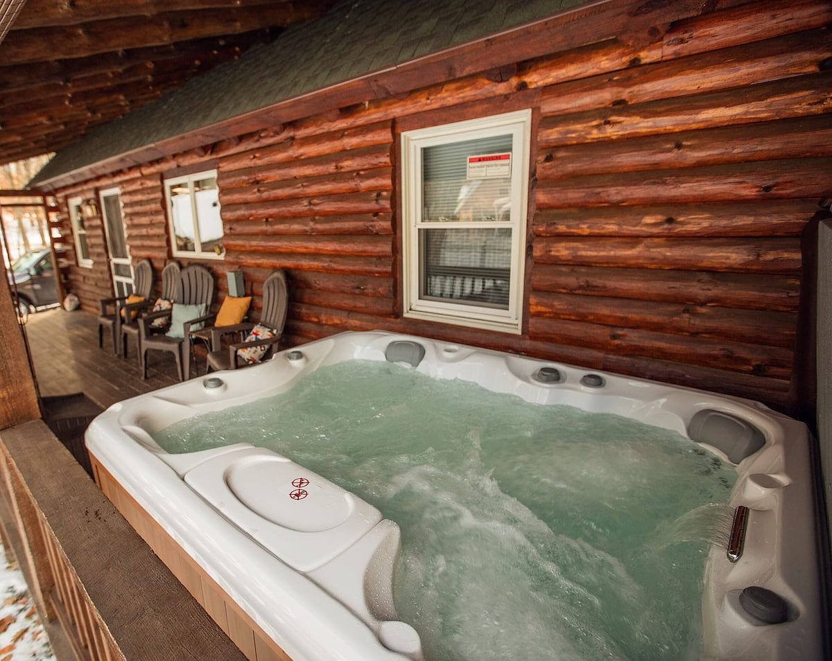 Private Sundance Spa hot tub on the Winnipecabin back porch